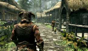 A screenshot from the game The Elder Scrolls V: Skyrim, showing a muscular man with a horned helmet walking down a lush village street.