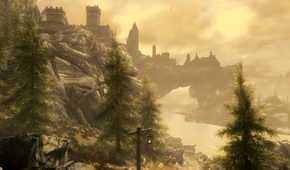 A screenshot from the game The Elder Scrolls V: Skyrim, showing a huge city in the background, with a river running underneath it.