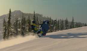 Screenshot from video game Sledders of person on snowmobile driving up a snowy hill