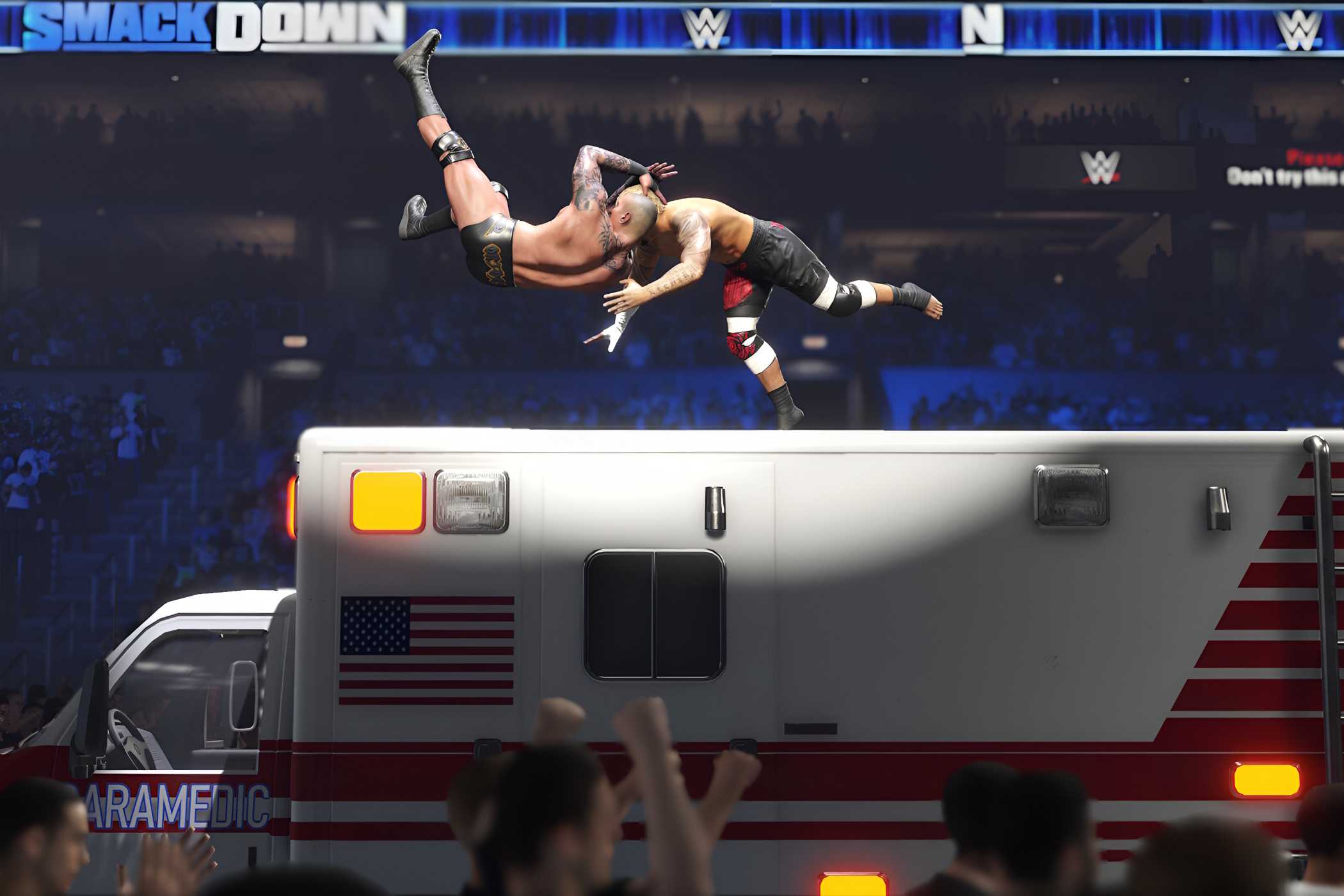 A screenshot from WWE 2K24, showing Randy Orton hit an RKO to his opponent while atop an ambulance.