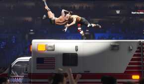 A screenshot from WWE 2K24, showing Randy Orton hit an RKO to his opponent while atop an ambulance.