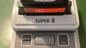 Innovation Super 8 Tristar with RetroGen adapter and Sega Genesis game