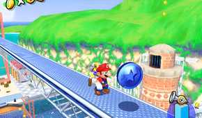A screenshot from the game Super Mario Sunshine, showing gameplay where Mario is about to grab a blue coin, with huge green mountains behind him.