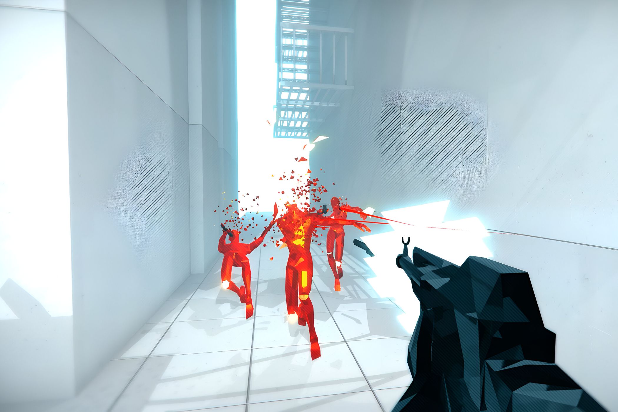A screenshot from the game Superhot, showing the protagonist wielding a rifle, shooting at three hostiles in red as they disintegrate upon coming into contact with bullets.