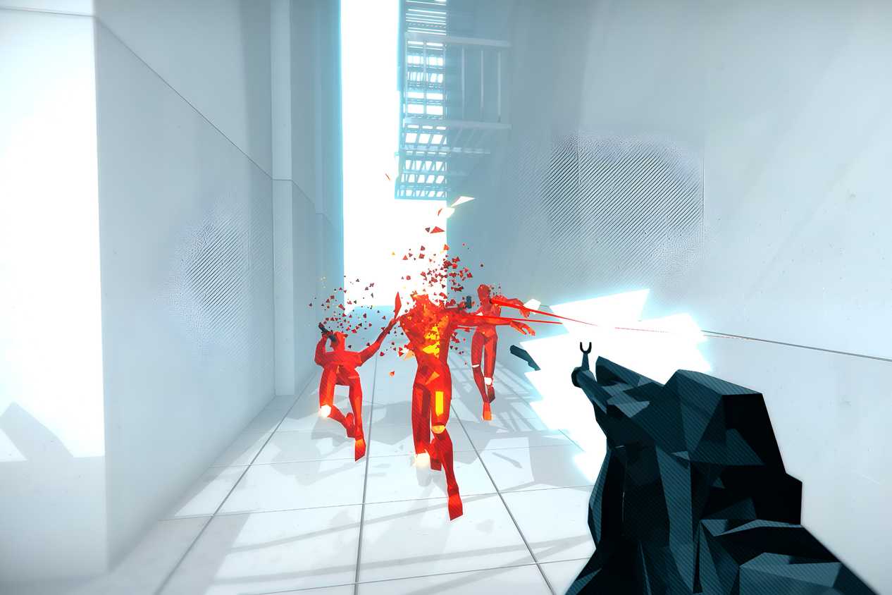 A screenshot from the game Superhot, showing the protagonist wielding a rifle, shooting at three hostiles in red as they disintegrate upon coming into contact with bullets.