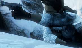 A screenshot from the game Uncharted 2, showing a man brandishing a gun while climbing a snowy ledge.