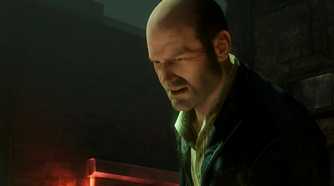 A screenshot from the game Uncharted 2, showing Charlie Cutter, a bald man, wearing a suit with a grimace on his face.