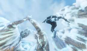 A screenshot from the game Uncharted 2, showing tall, stony statues covered in snow as a human falls down from them.
