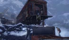 A screenshot from the game Uncharted 2: Among Thieves, showing a derailed train in a snowy mountain with the protagonist standing underneath it.
