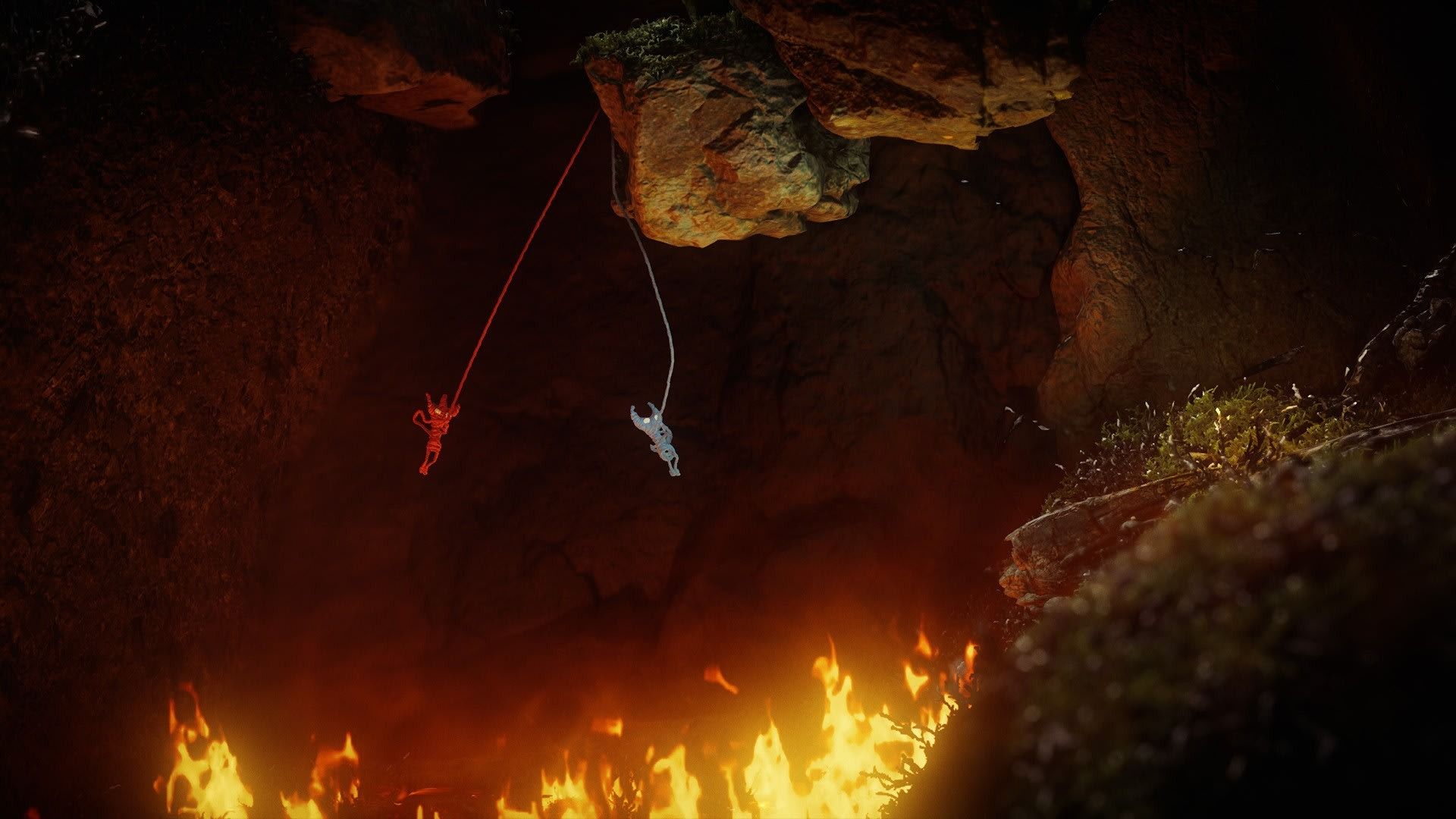Two Yarny's escaping the fire in Unravel 2
