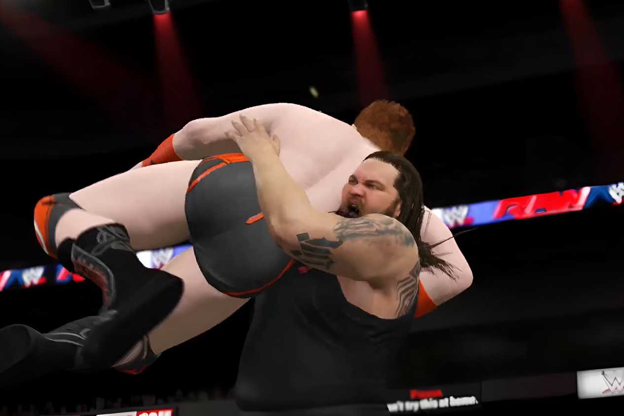 A WWE 2K15 screenshot showing Bray Wyatt slam Sheamus.