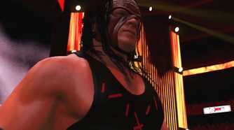 A WWE 2K15 screenshot showing Kane, wearing a red and black vest and a red mask, make his entrance.