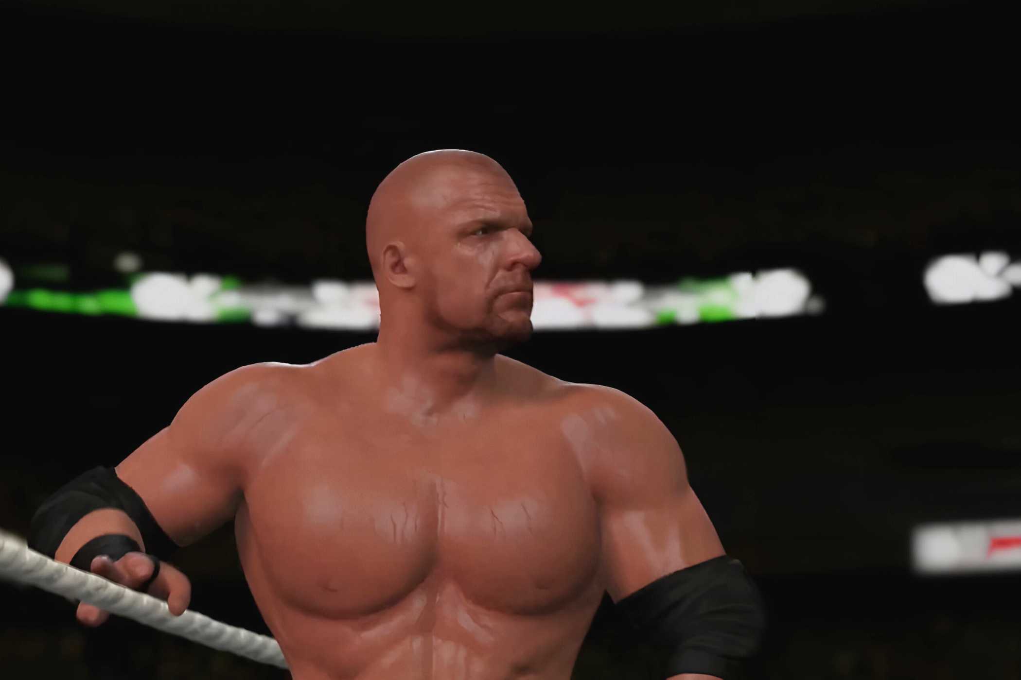 A WWE 2K15 screenshot showing a bald Triple H make his entrance to the ring.