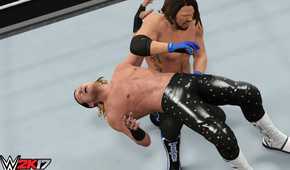 A screenshot from WWE 2K17, showing superstar AJ Styles hit a backbreaker on Dolph Ziggler.