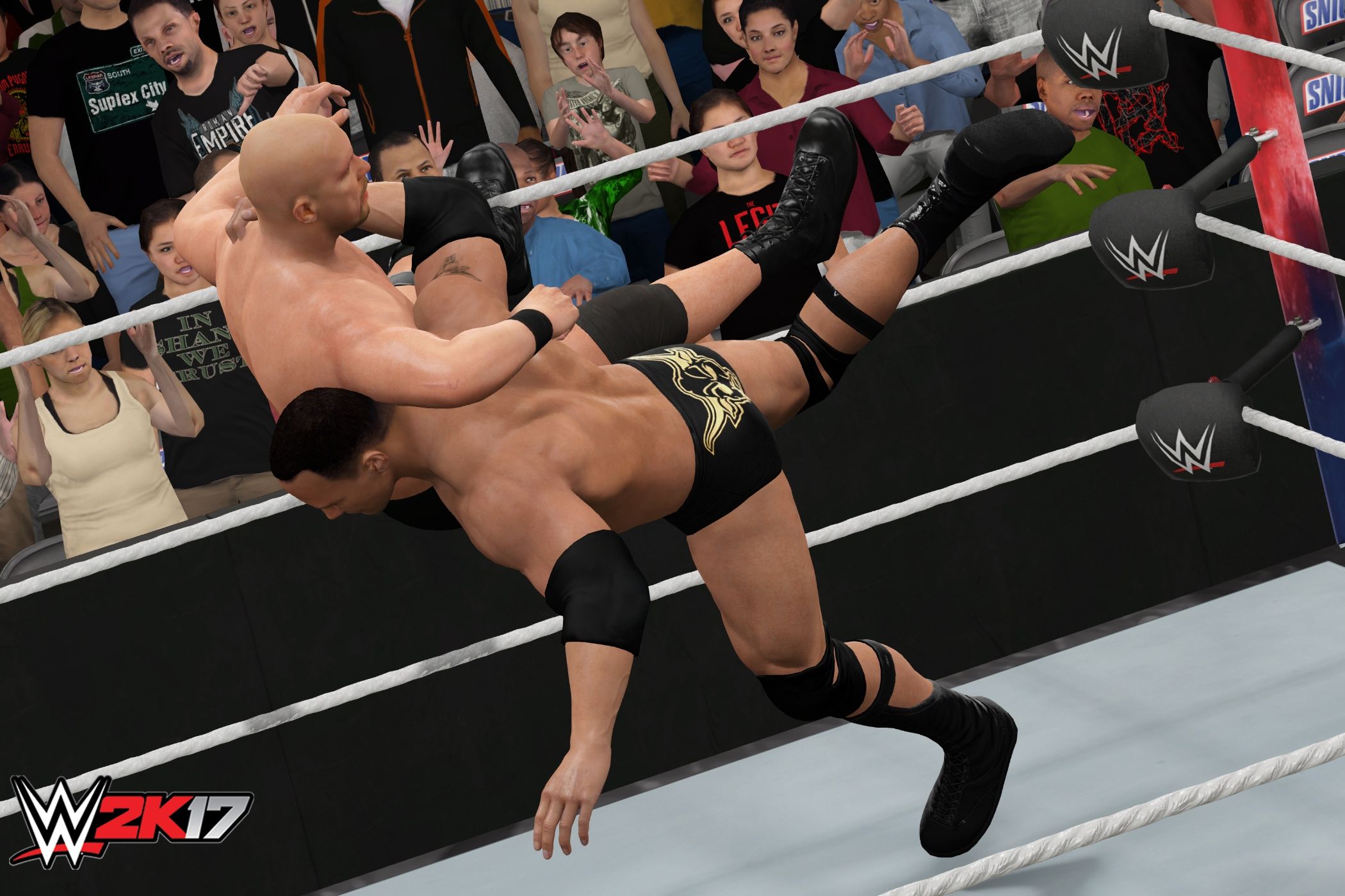 A screenshot from WWE 2K17, showing The Rock hit the Rock Bottom on Stone Cold Steve Austin.