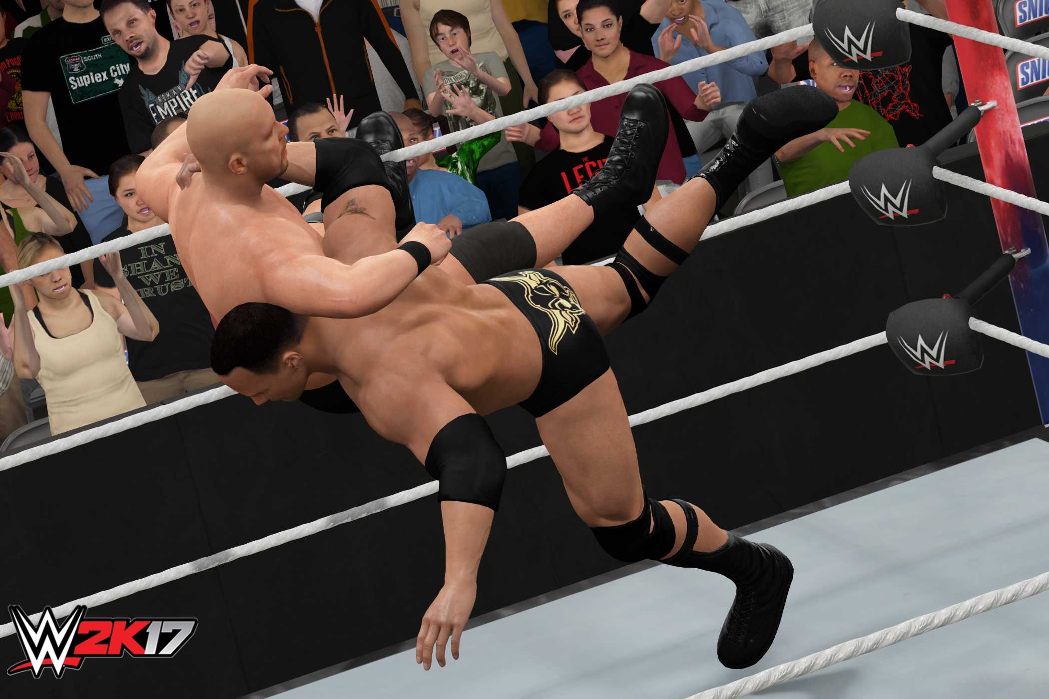 A screenshot from WWE 2K17, showing The Rock hit the Rock Bottom on Stone Cold Steve Austin.