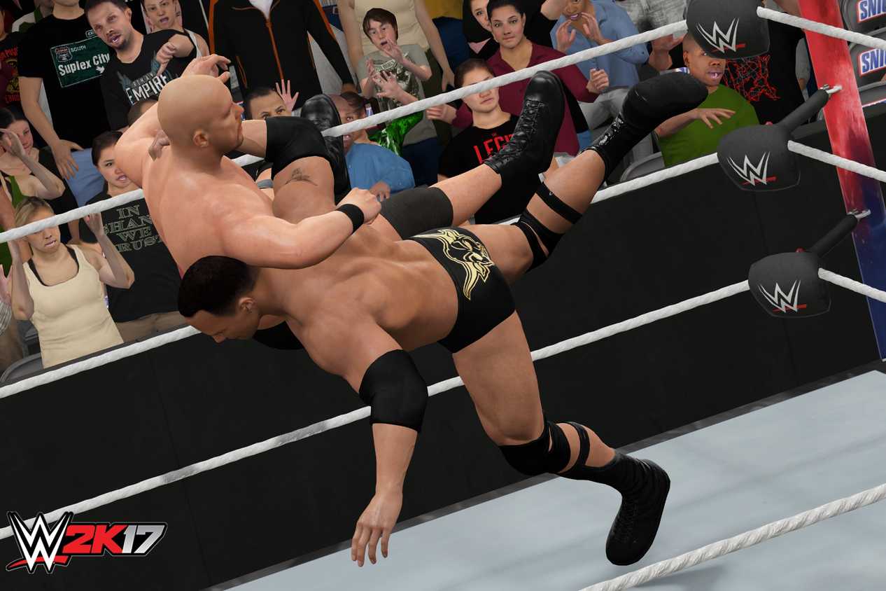 A screenshot from WWE 2K17, showing The Rock hit the Rock Bottom on Stone Cold Steve Austin.