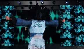 A screenshot from WWE 2K18, showing Charlotte Flair make her entrance.