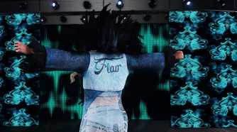 A screenshot from WWE 2K18, showing Charlotte Flair make her entrance.