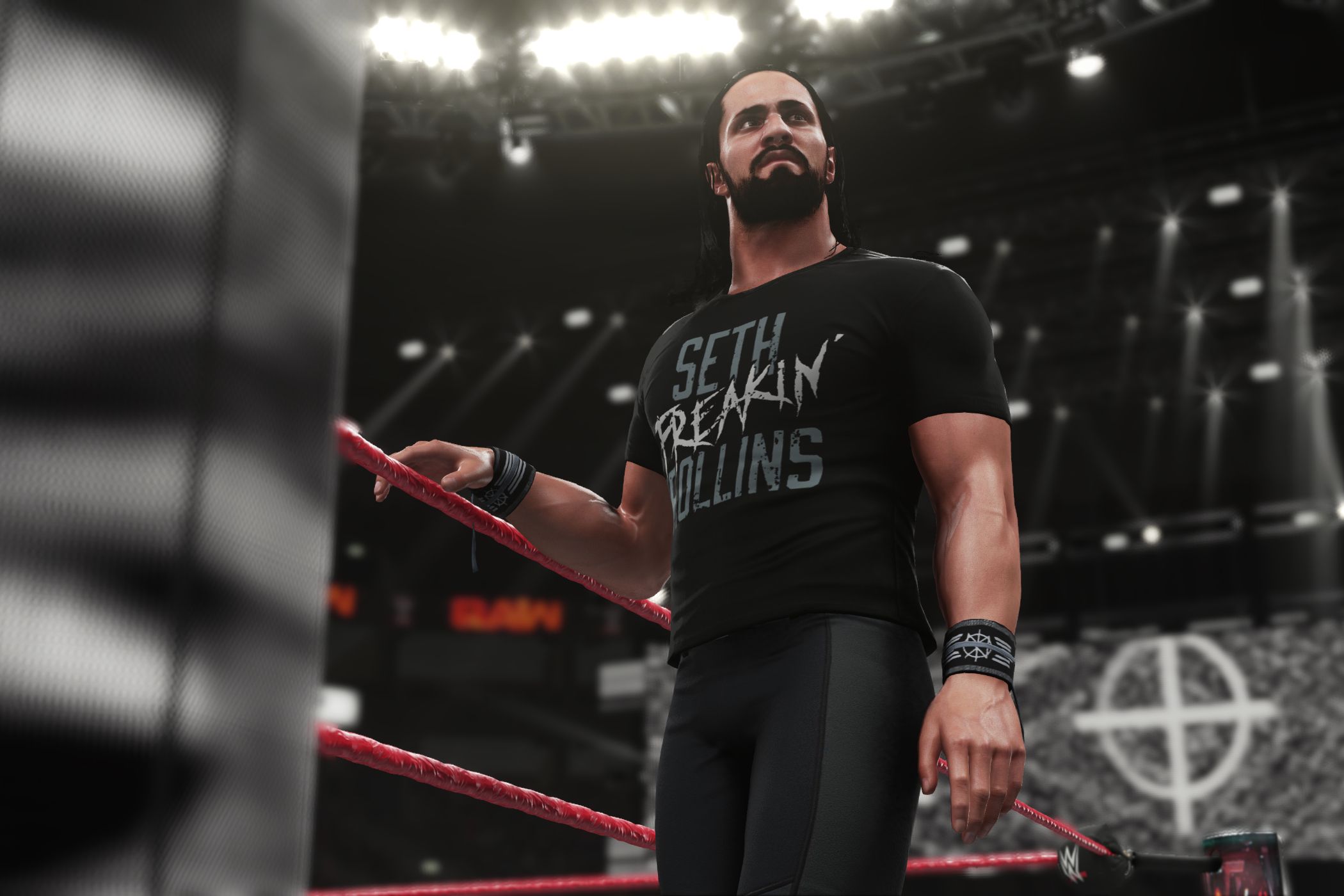 A screenshot from WWE 2K18, showing Seth Rollins make his way to the ring wearing all-black.