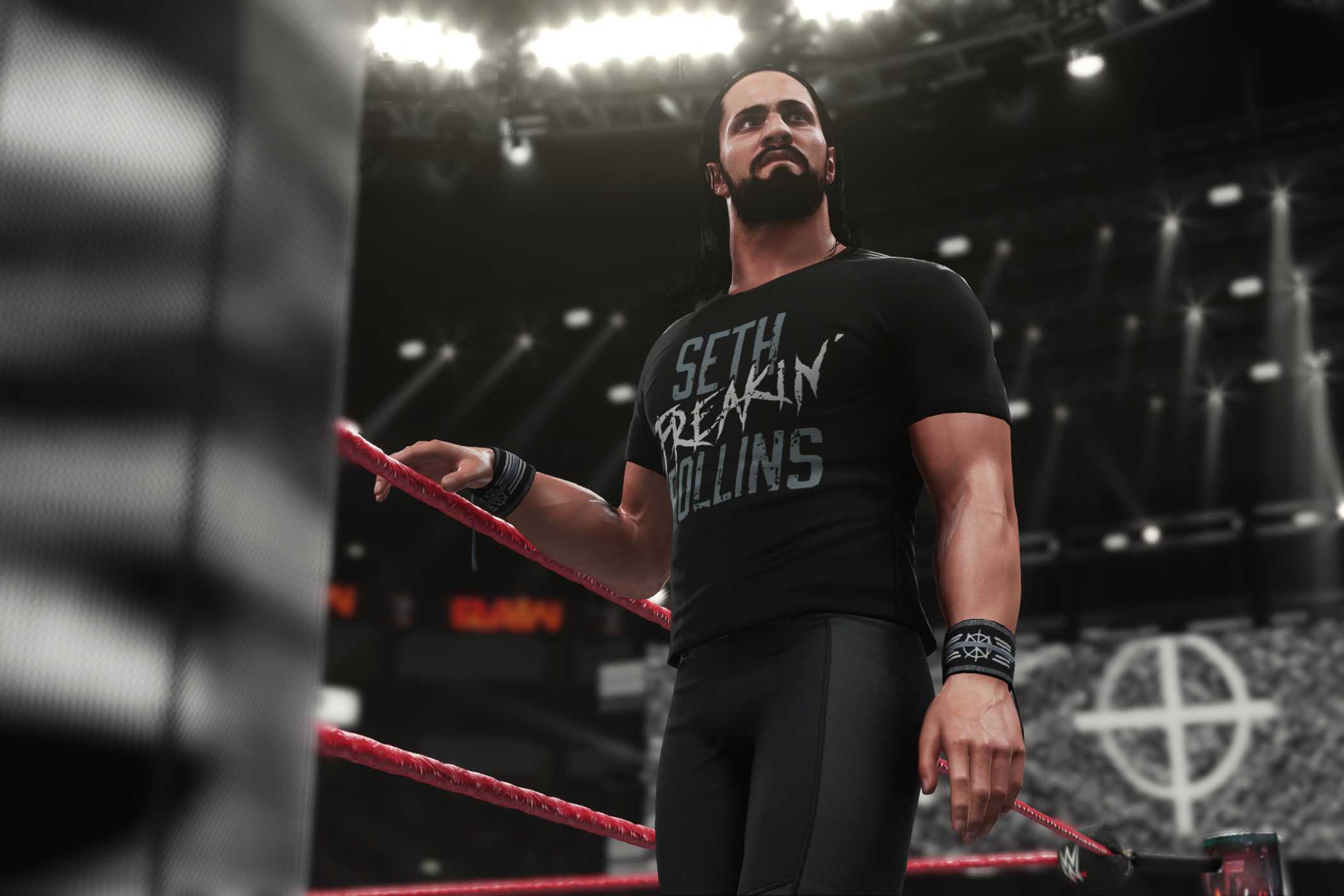 A screenshot from WWE 2K18, showing Seth Rollins make his way to the ring wearing all-black.