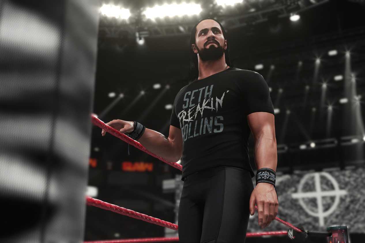 A screenshot from WWE 2K18, showing Seth Rollins make his way to the ring wearing all-black.