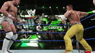 A screenshot from WWE 2K19, showing John Cena, wearing yellow pants, face off against Bryan Danielson in white tights, inside the ring.