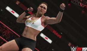 A screenshot from WWE 2K19, showing Rowdy Ronda Rousey taking a boxing stance.