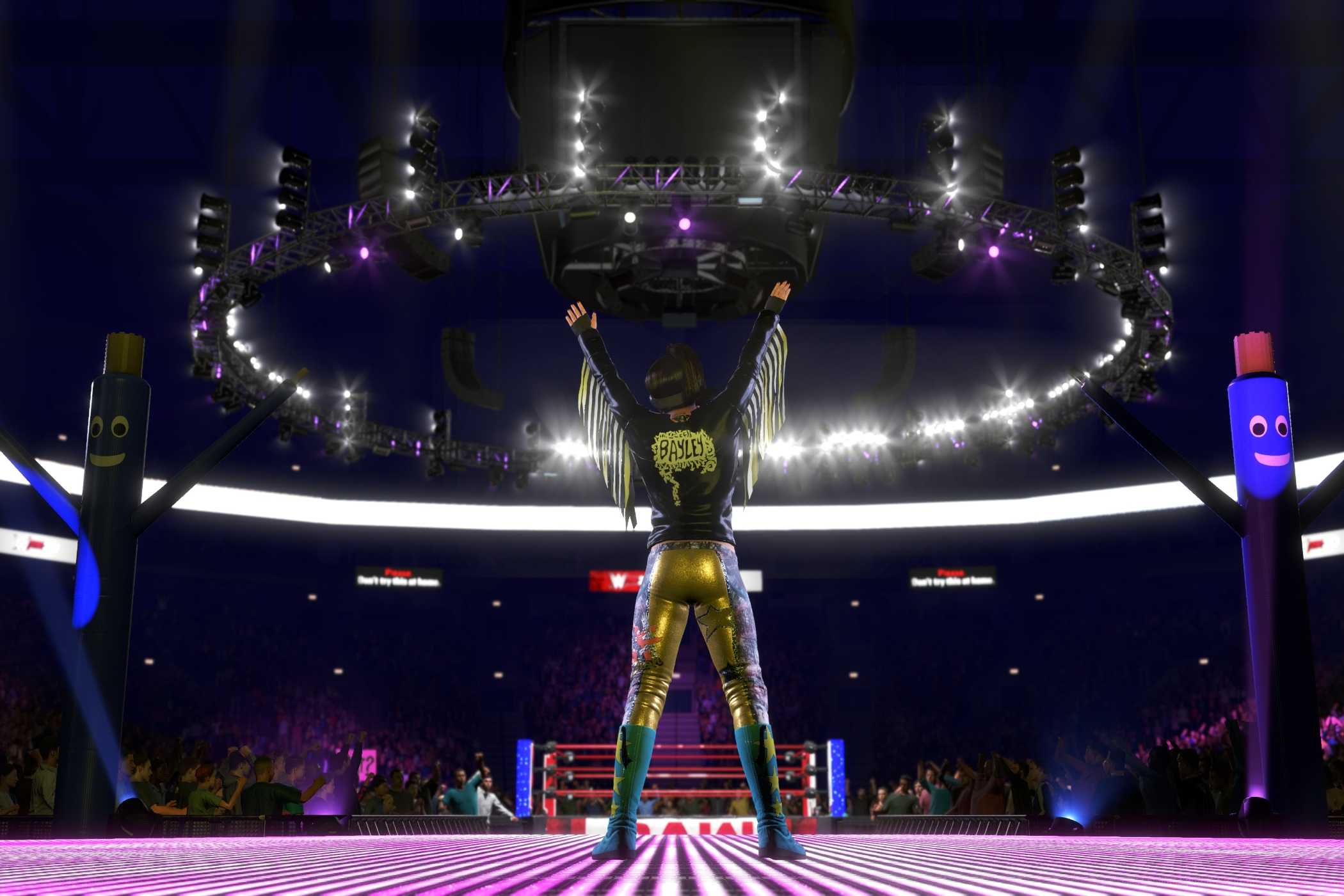 Rear view of WWE superstar Bayley facing the ring