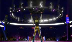 Rear view of WWE superstar Bayley facing the ring