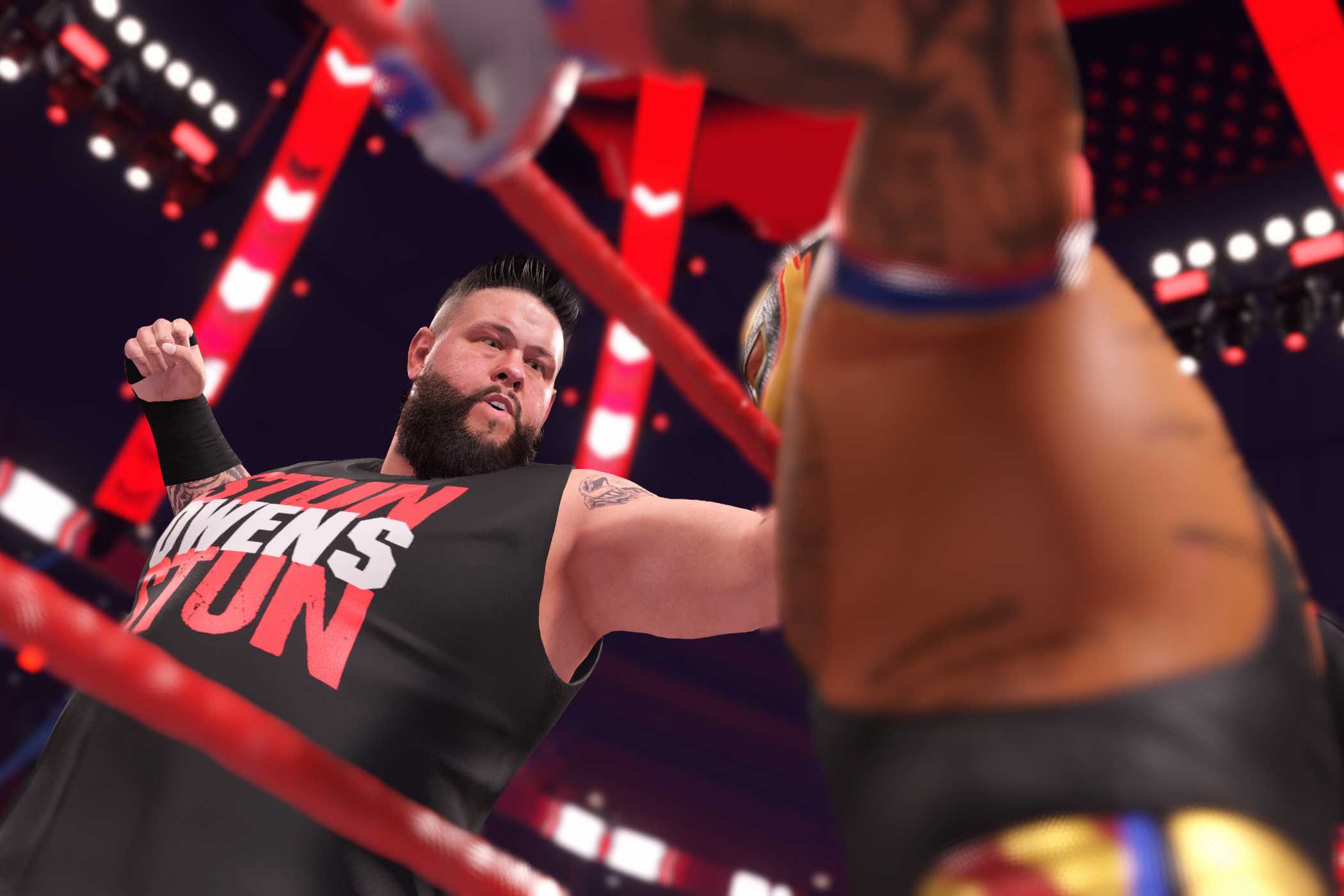 A screenshot from WWE 2K22, showing Kevin Owens inside the ring attacking Rey Mysterio on the apron.