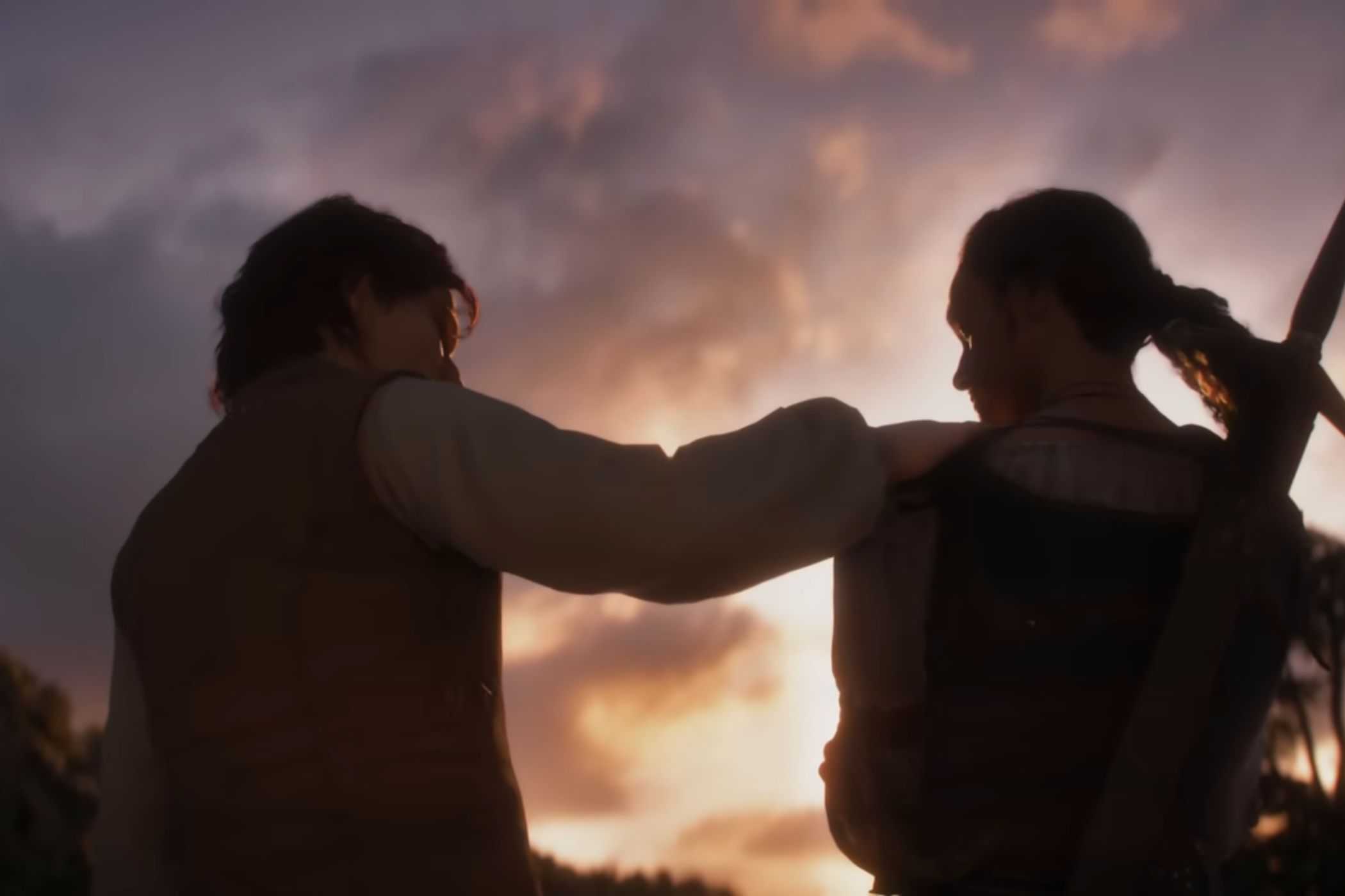 Fable man and woman sitting together at sunset