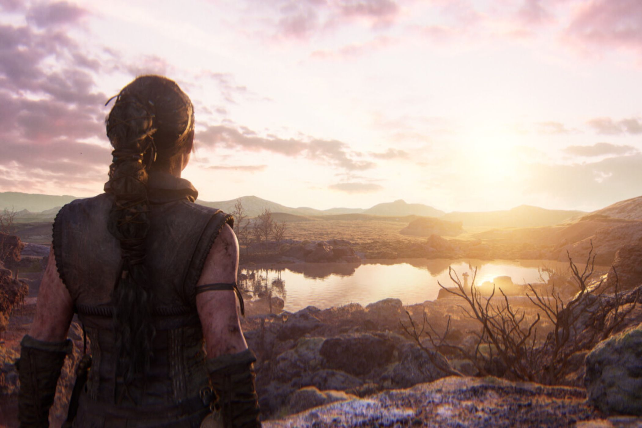 Hellblade 2 Senua standing on cliff at sunrise