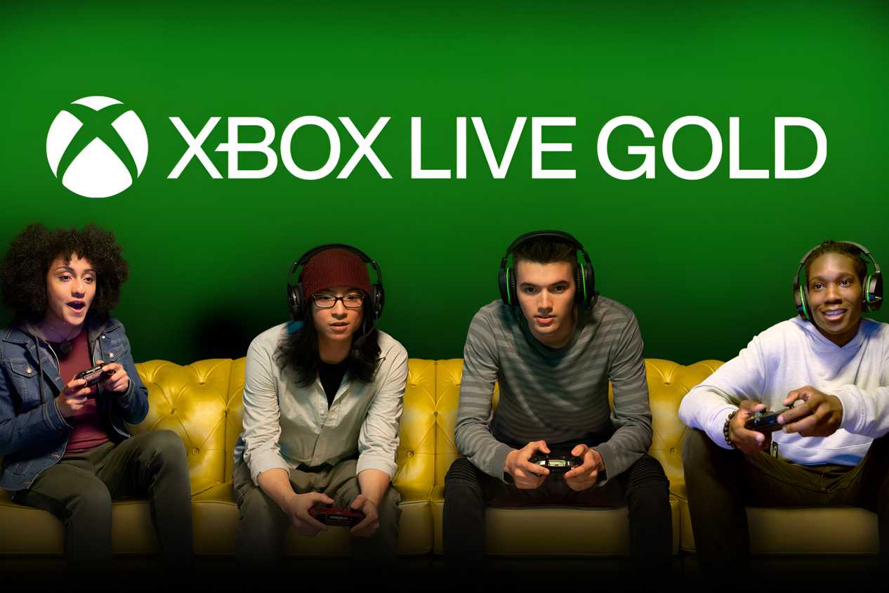 Four people sitting on a gold couch with headphones over their ears and controllers in their hands.