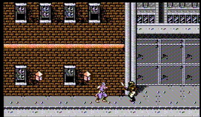 fighting an enemy in a city in Ninja Gaiden