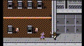 fighting an enemy in a city in Ninja Gaiden