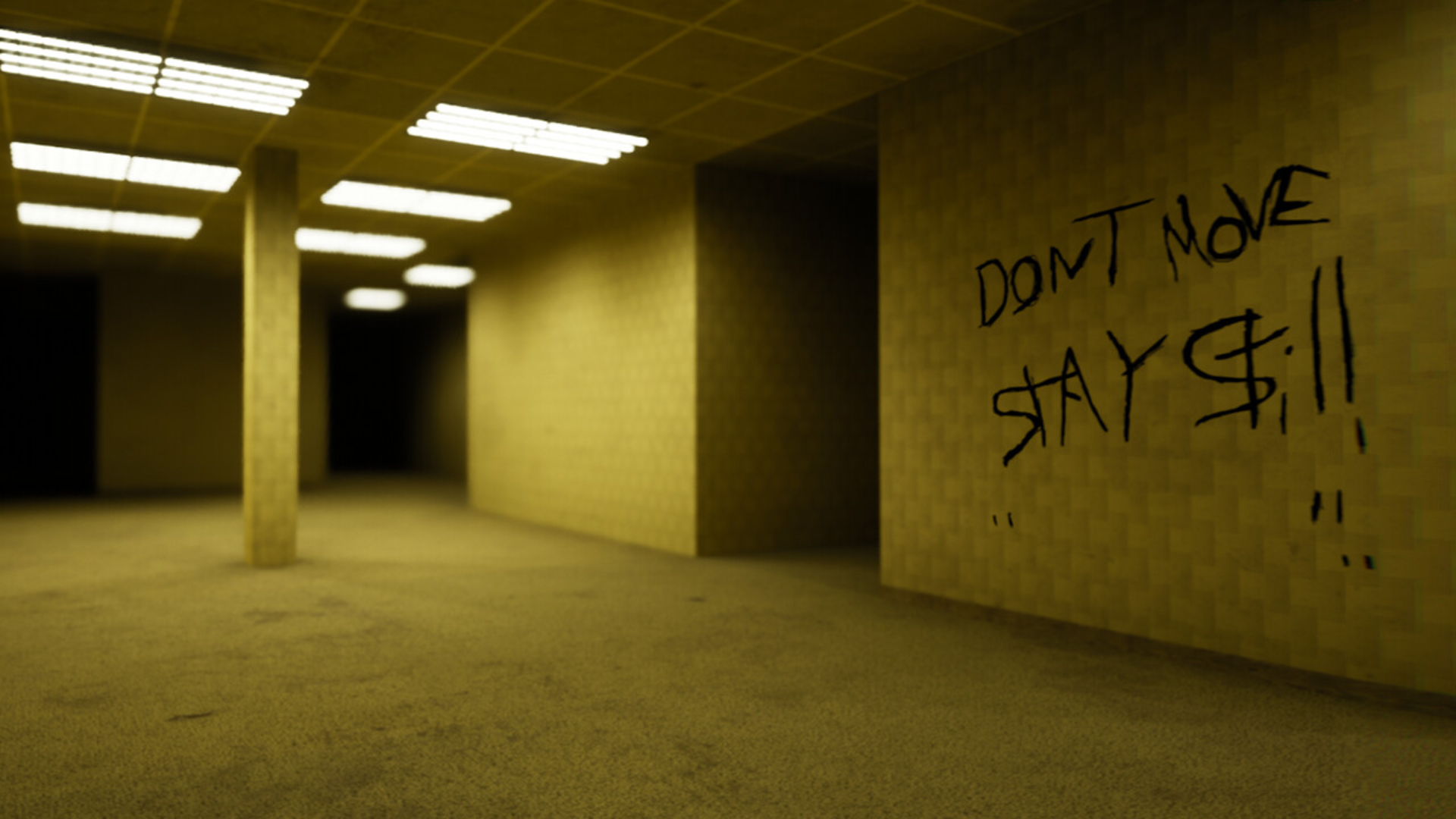 A dimly lit hallway with writing on the wall