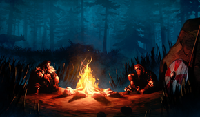 Two men sitting by a fire