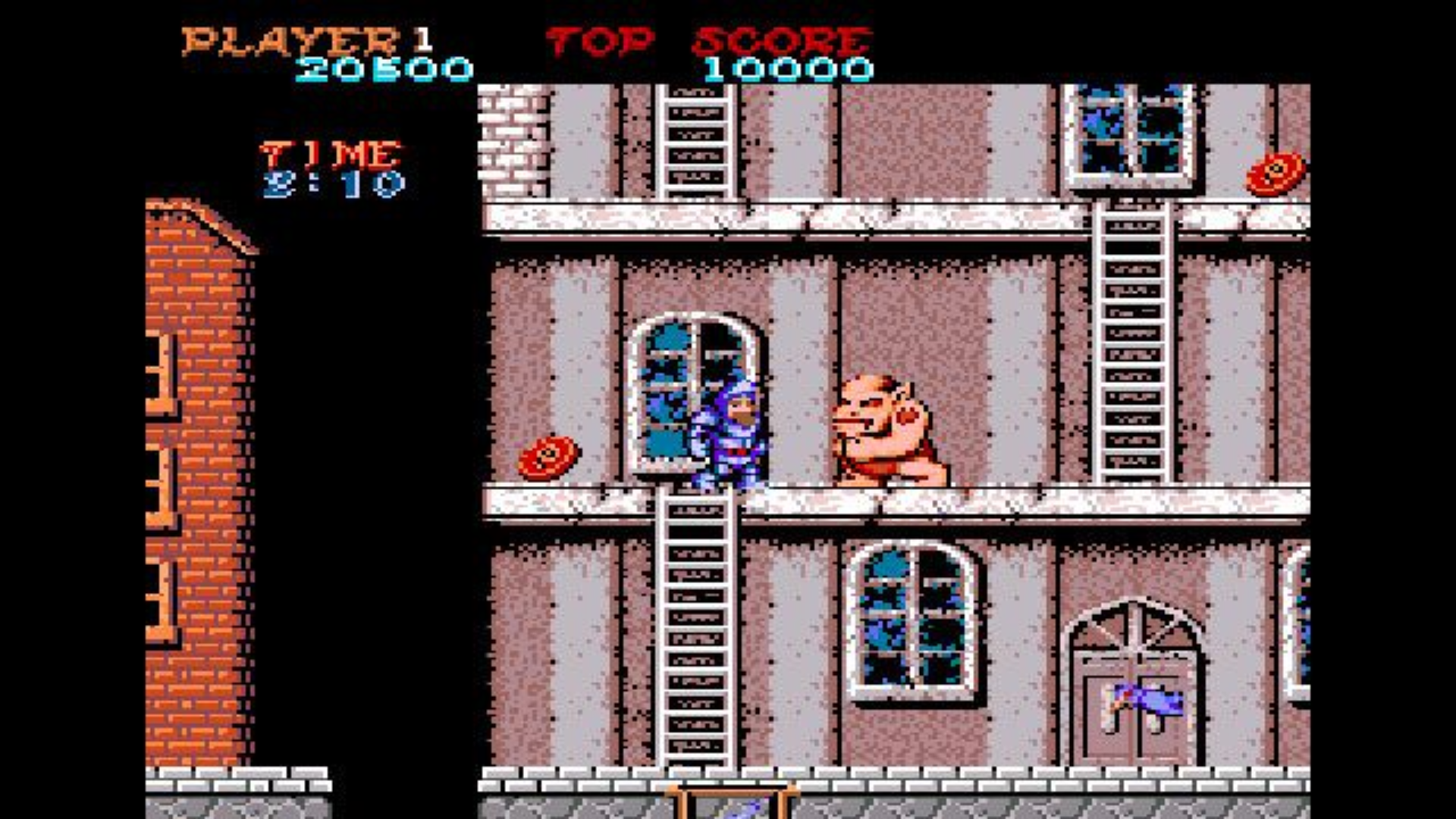 fighting monsters in a city in Ghosts 'n Goblins