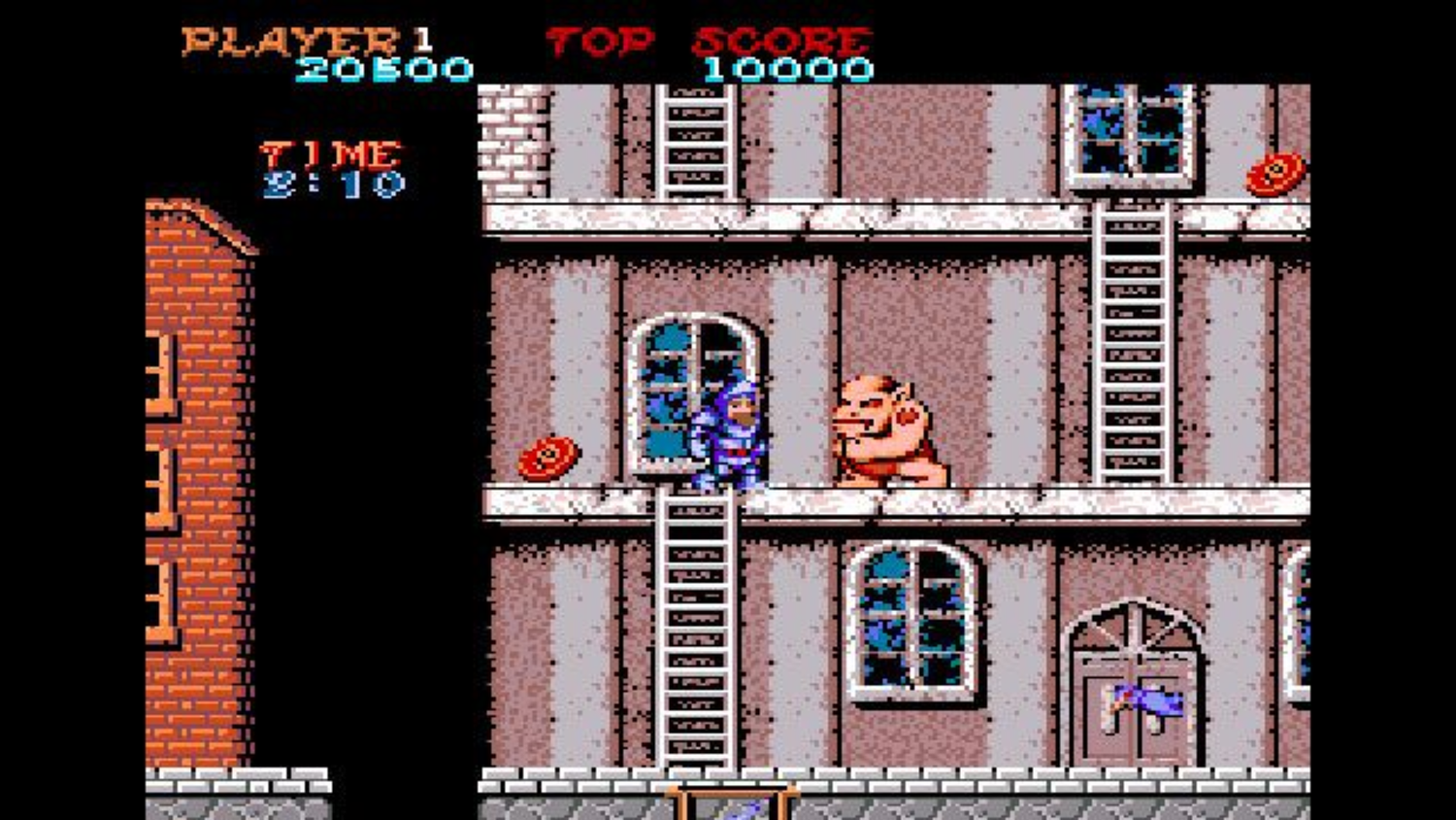 fighting monsters in a city in Ghosts 'n Goblins