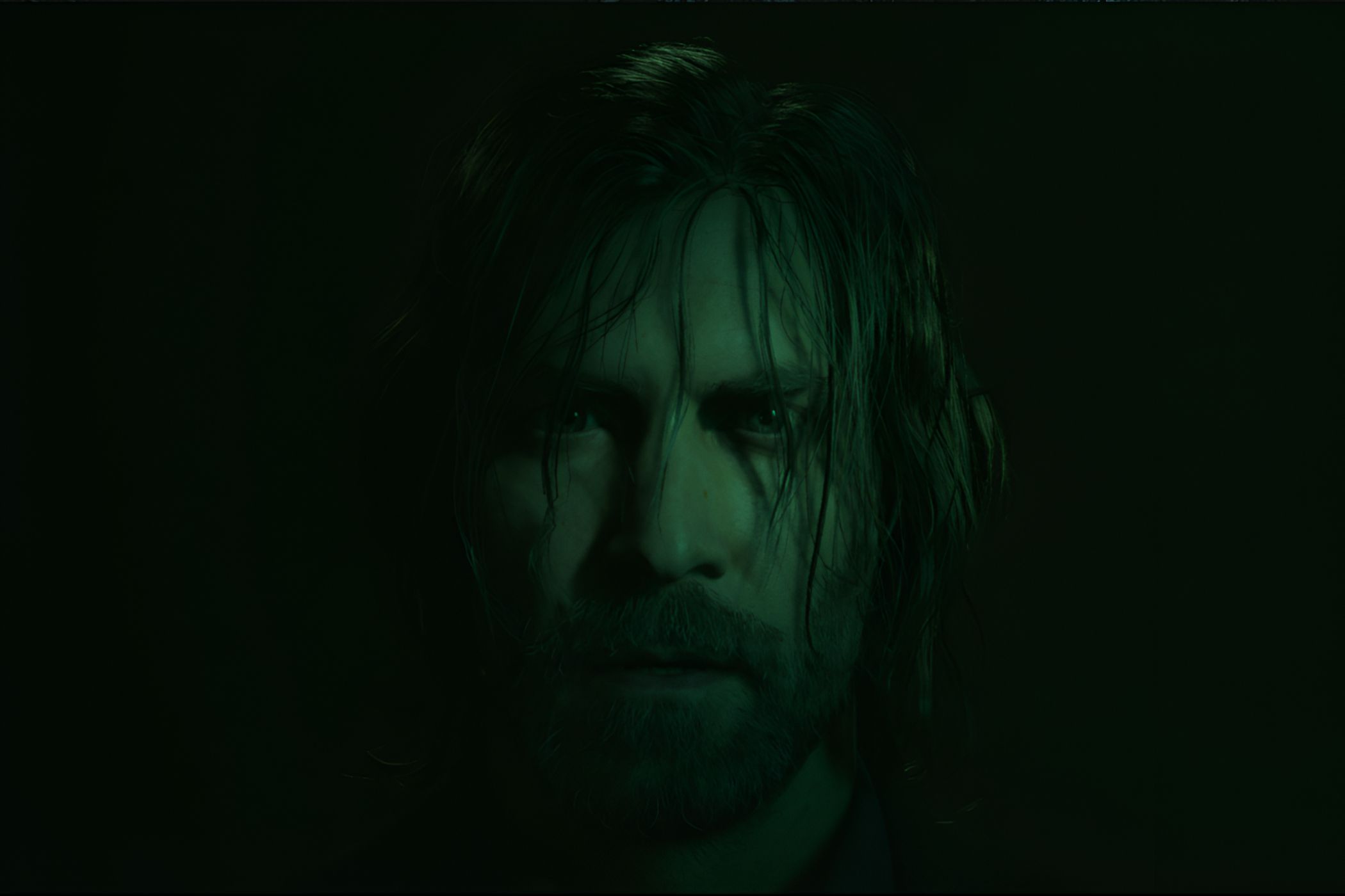 An image from Alan Wake II, showing the protagonist Alan Wake staring into the camera with hair strewn across his face.