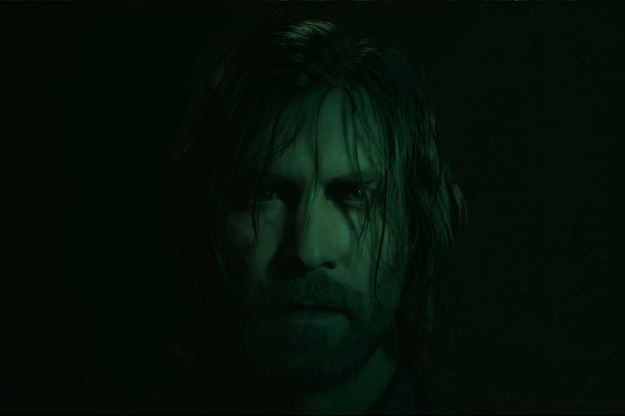 An image from Alan Wake II, showing the protagonist Alan Wake staring into the camera with hair strewn across his face.