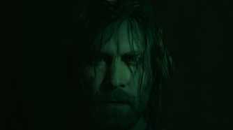 An image from Alan Wake II, showing the protagonist Alan Wake staring into the camera with hair strewn across his face.