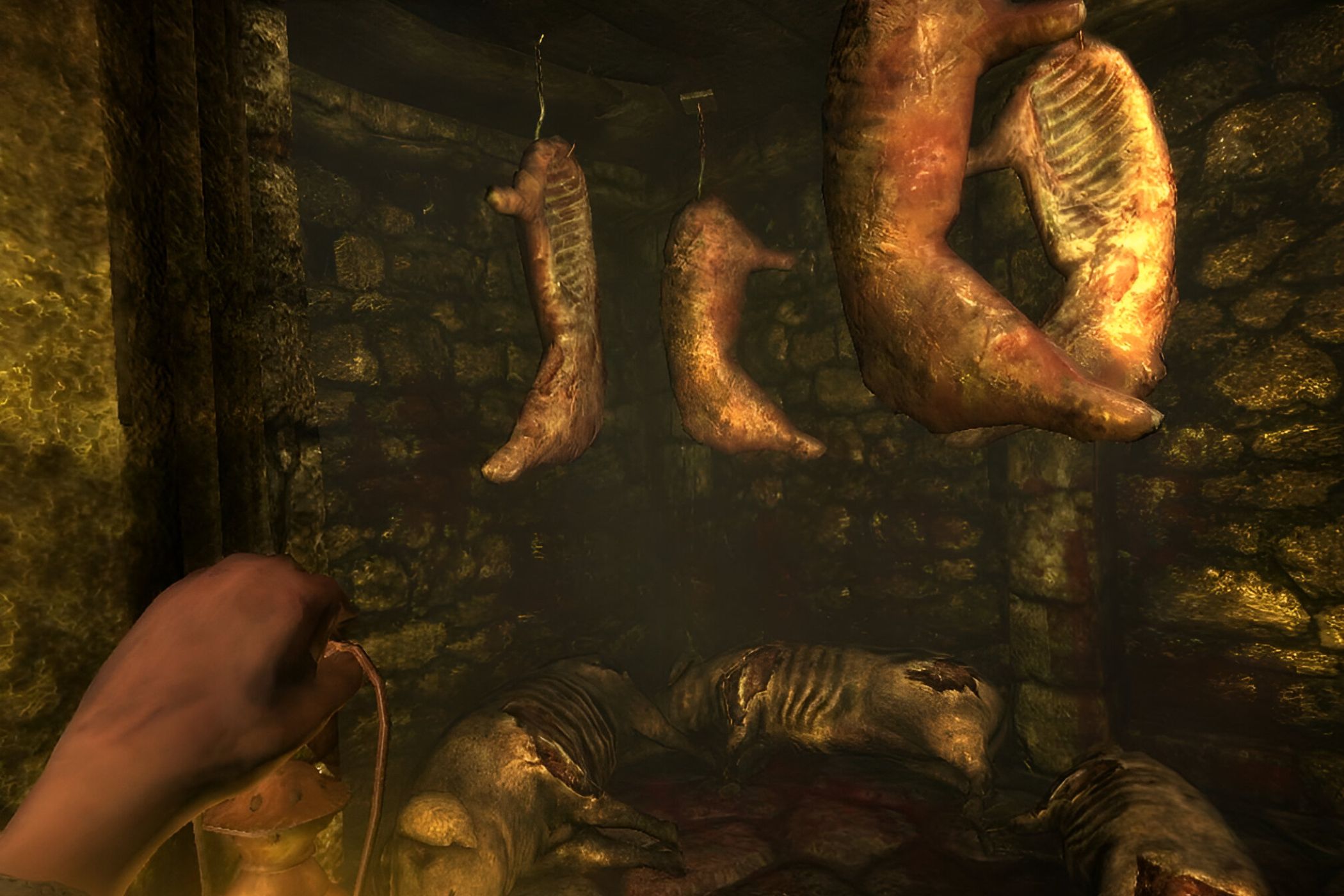 A screenshot from the game Amnesia: The Dark Descent, showing stuck pigs hanging from metal hooks.