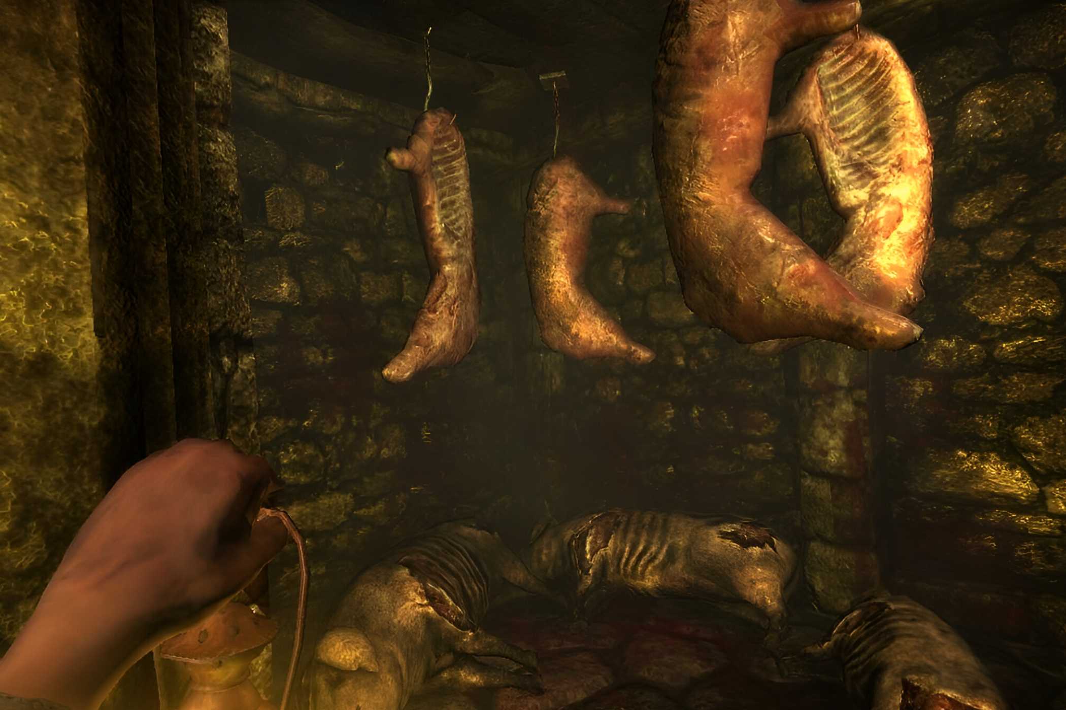 A screenshot from the game Amnesia: The Dark Descent, showing stuck pigs hanging from metal hooks.