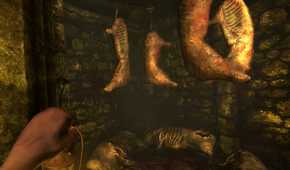 A screenshot from the game Amnesia: The Dark Descent, showing stuck pigs hanging from metal hooks.
