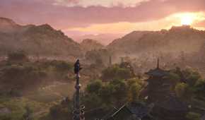 A screenshot from Assassin's Creed Shadows, showing the protagonist Naoe perched atop a tall pillar, taking in the mountainside.