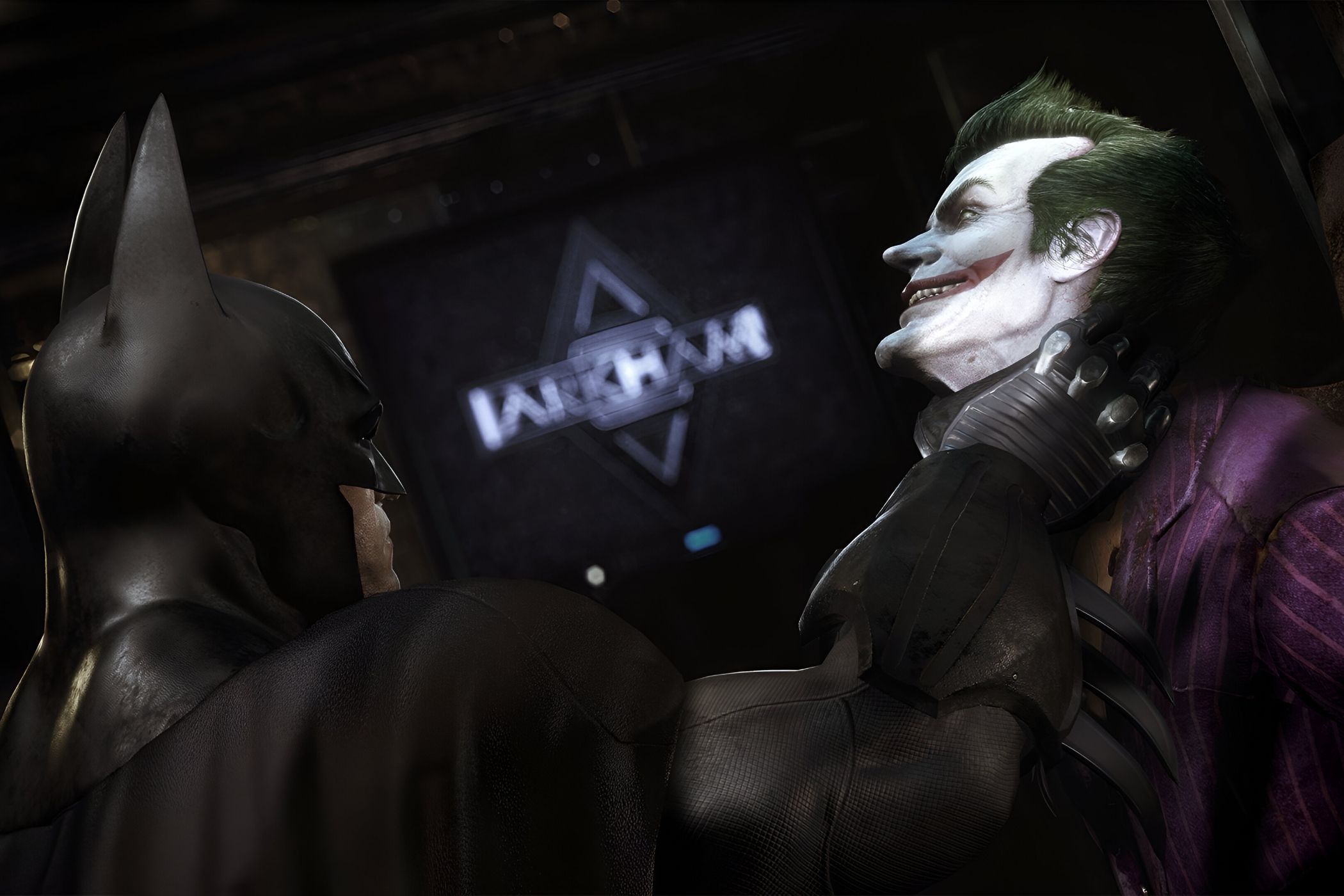 An image from the game "Batman: Arkham City", showing the Batman lift the Joker up by his neck.