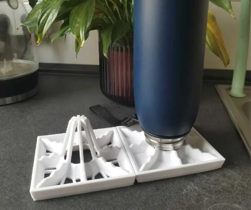 A bottle on top of a drying rack