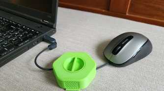 Wire of the mouse inserted inside 3D printed cable organizer
